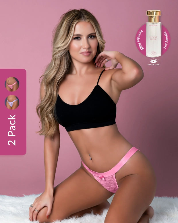 Woman wearing black bra and pink panties with a perfume bottle in the corner on a pink background