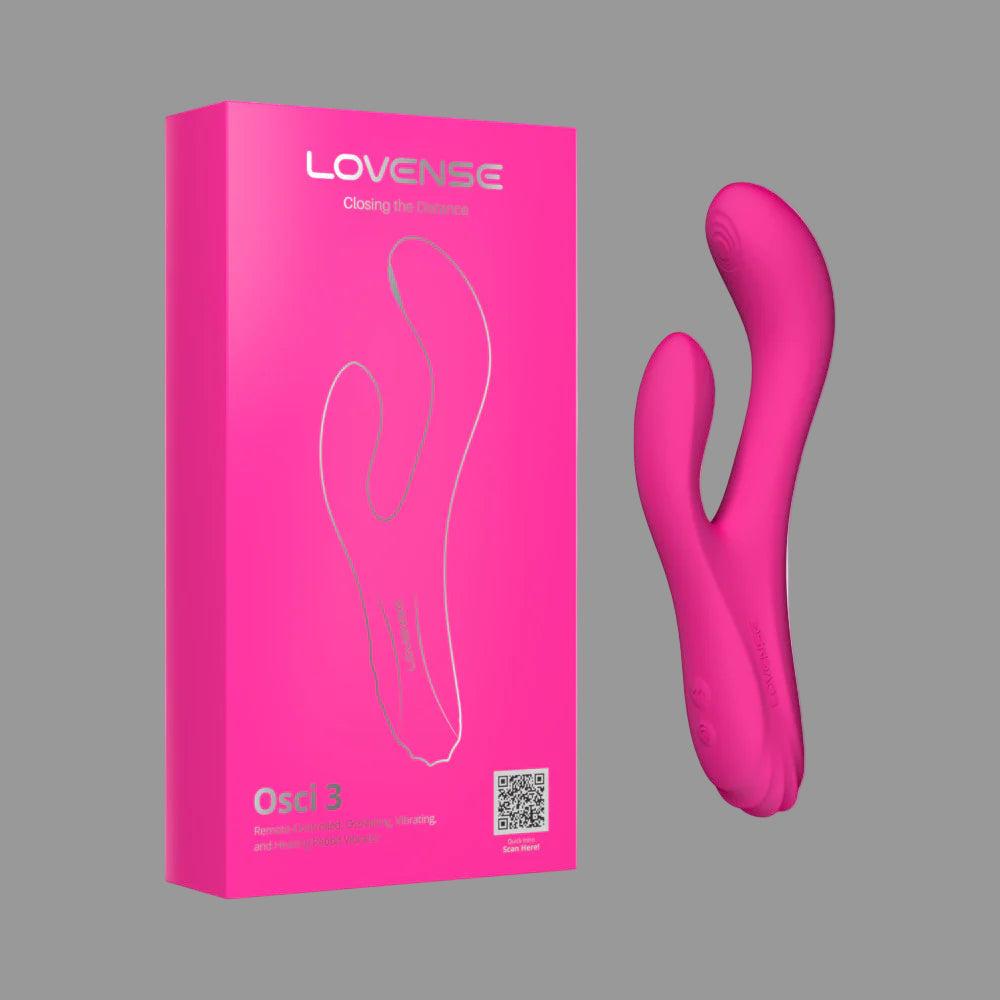 Pink Lovense device and packaging on a white background