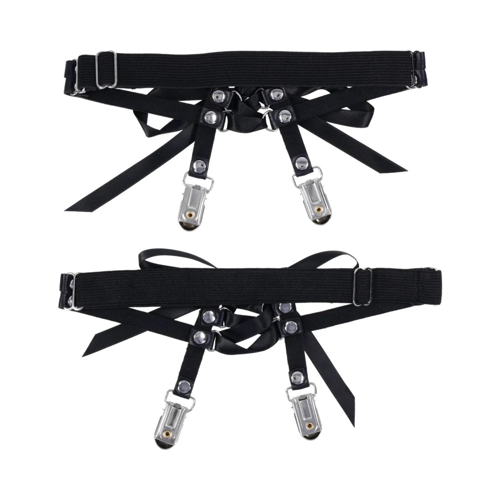 Black harness with metal clasps on a white background