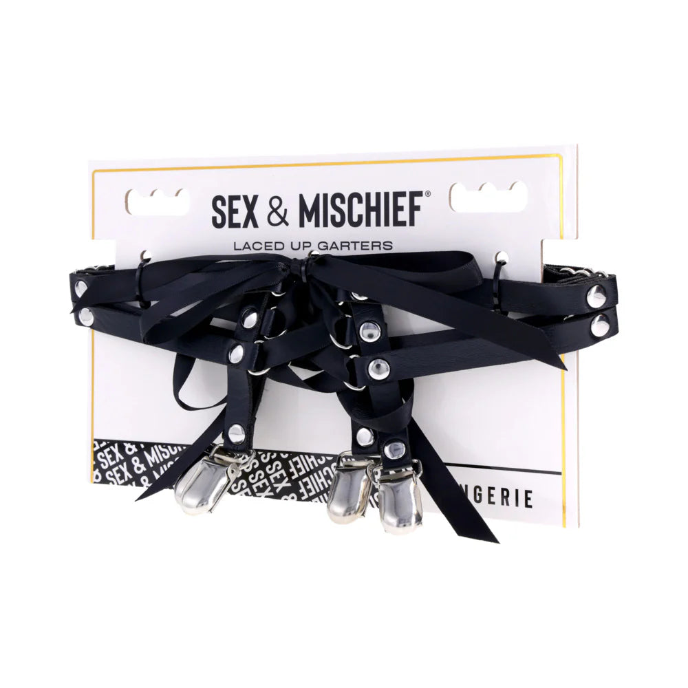 Black laced-up garters with silver accents on a 'Sex & Mischief' branded card.